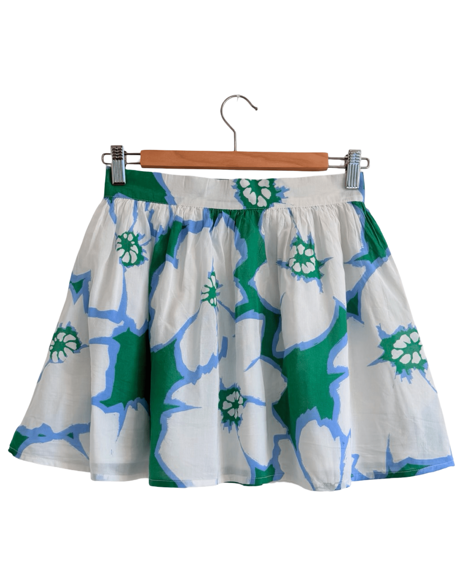 Hibiscus Mini Skirt — white and periwinkle floral on green cotton, A-line mini skirt with pockets | Sur La Vague