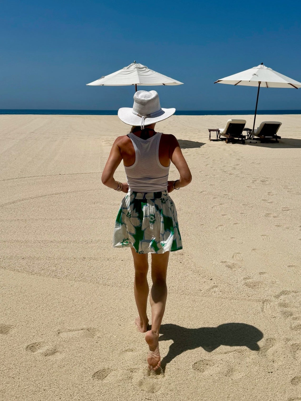Hibiscus Mini Skirt — white and periwinkle floral block print on sage green cotton | Sur La Vague
