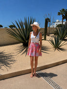 Riviera Mini Skirt — multicolor floral block print on hot pink cotton, A-line mini | Sur La Vague